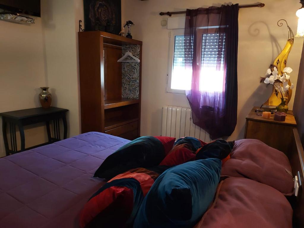 A bed or beds in a room at Raices