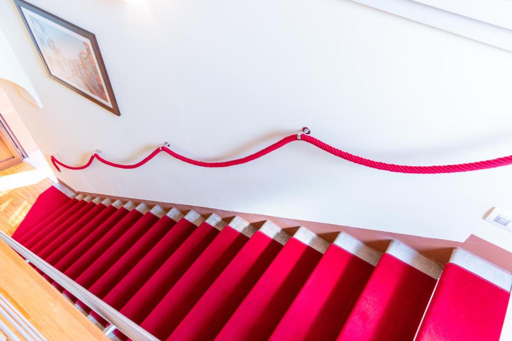 a red and white radiator in a room at Hotel Autoespresso Venice - Atika & Atif in Marghera