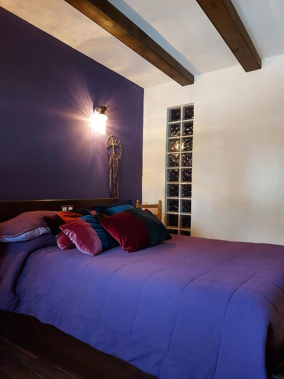 A bed or beds in a room at Raices