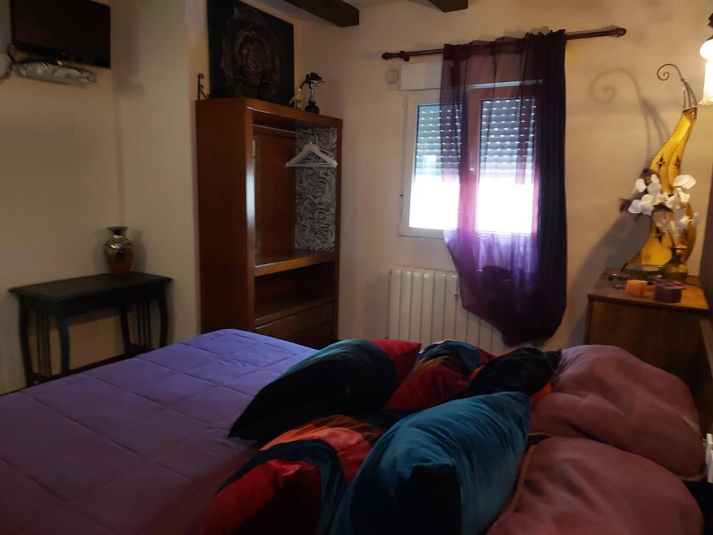 A bed or beds in a room at Raices
