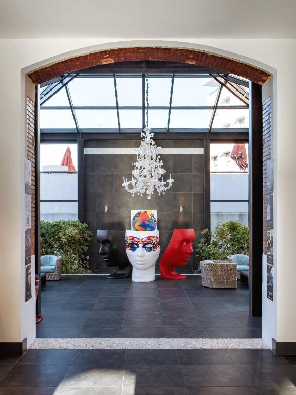 a room with a toilet in the middle of a building at New Hotel of Marseille - Vieux Port in Marseille