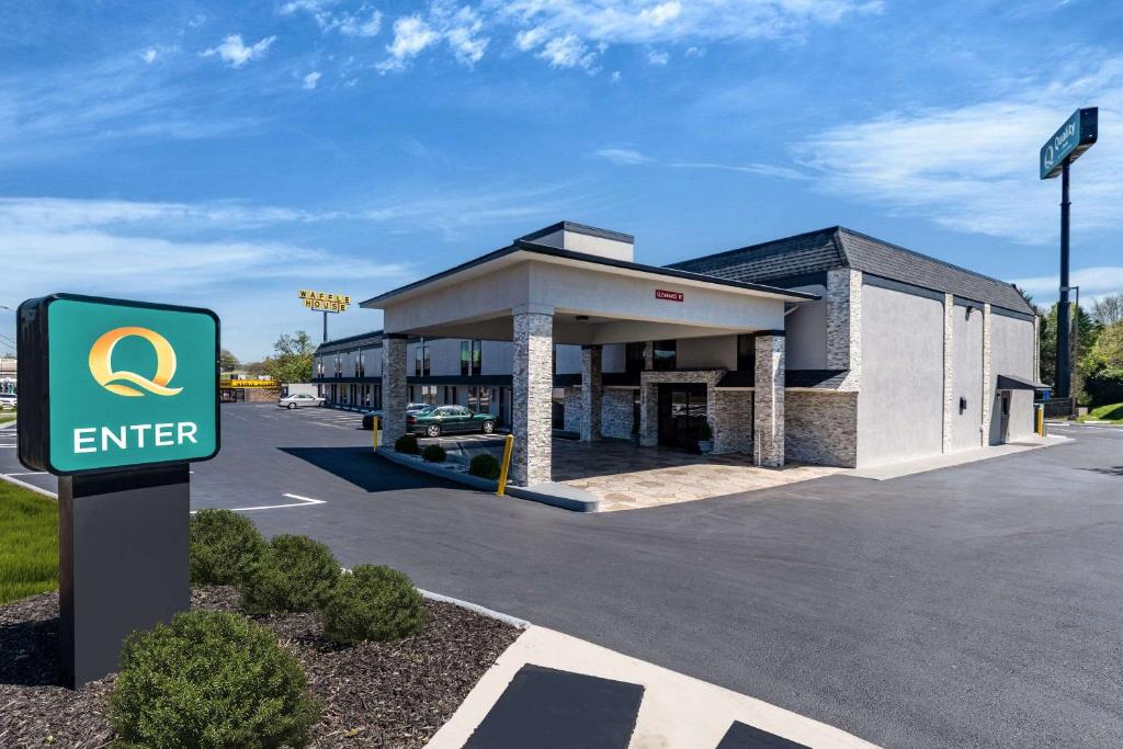 a gas station with a sign in front of it at Quality Inn Cleveland in Cleveland