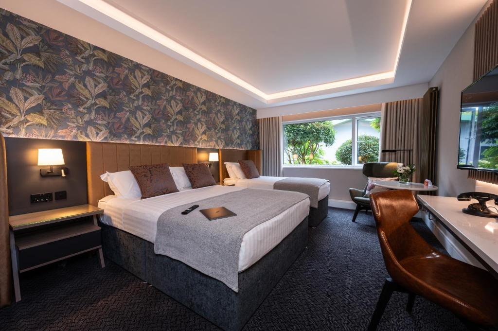 Postel nebo postele na pokoji v ubytování Hotel Kilkenny