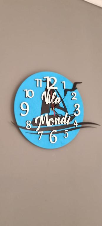 a clock on a wall with the words it is a yacht at Vila Mondi in Eforie Nord
