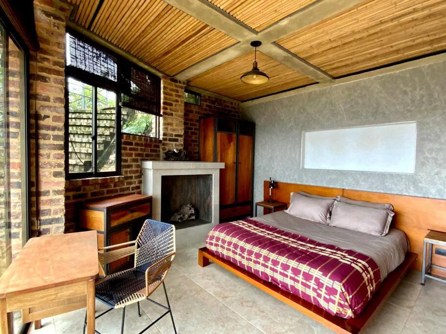 Postel nebo postele na pokoji v ubytování Suite en las Nubes Hotel Portal 360