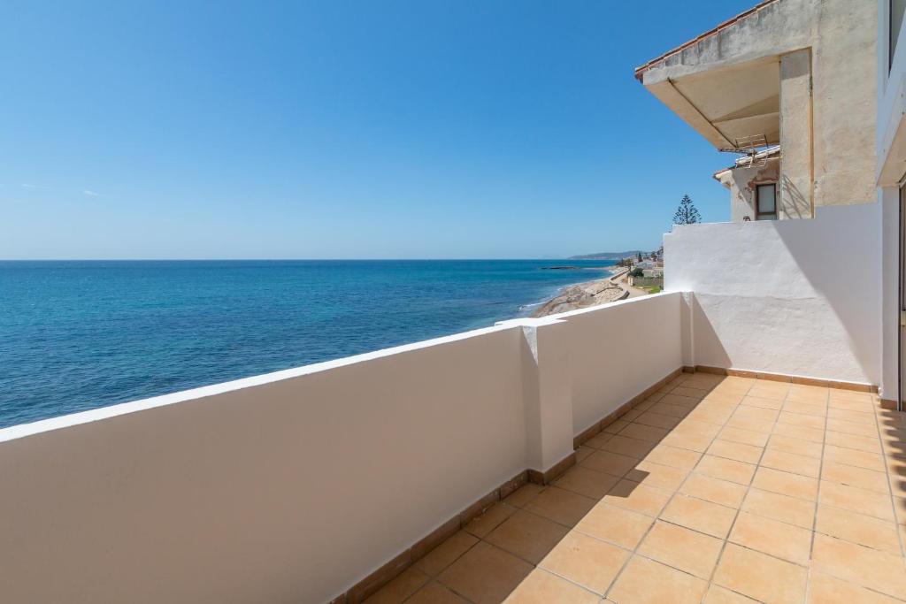 a balcony with a view of the ocean at Bahia Dorada 4 in Estepona