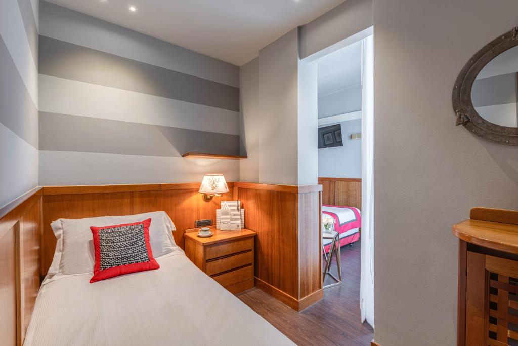 Postel nebo postele na pokoji v ubytování Hotel Vis à Vis