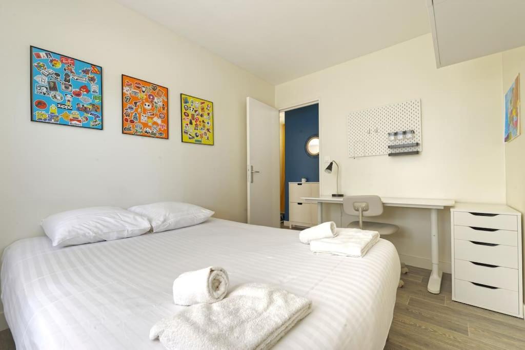 Un pat sau paturi &icirc;ntr-o camer&#x103; la Appartement de standing au c&oelig;ur de Rouen