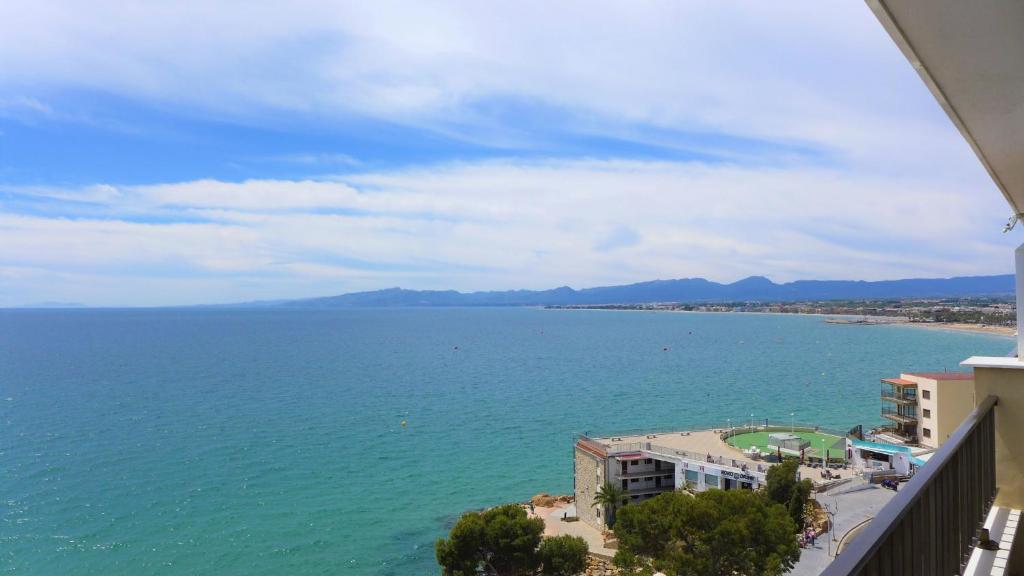 a view of the ocean from the balcony of a building at Apartamentos Nautilus in Salou