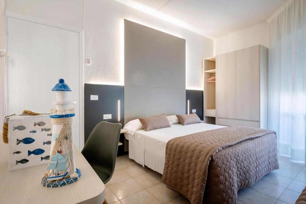 Postel nebo postele na pokoji v ubytování Hotel Marisa