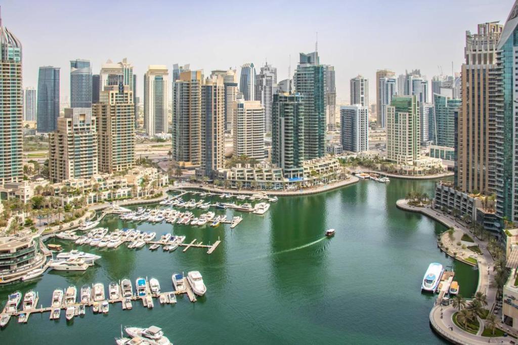 an aerial view of a city with boats in a harbor at Unique View Luxury- 26floor 2BDR at Damac Heights in Dubai