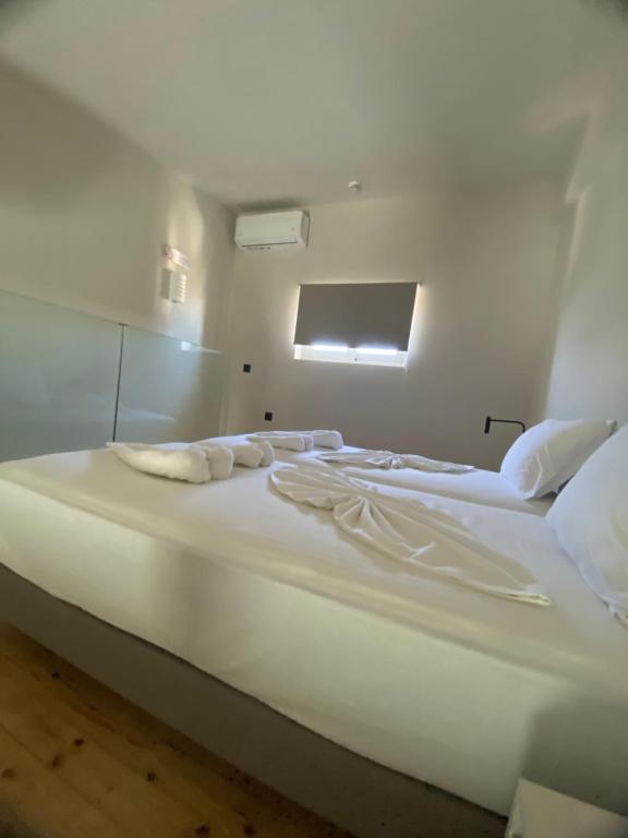 Postel nebo postele na pokoji v ubytování Barbie Hotel Apartments