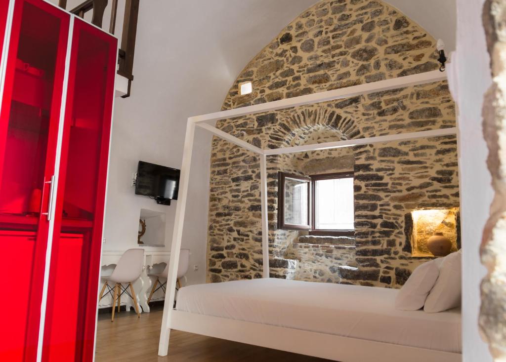 A bed or beds in a room at Lida Mary