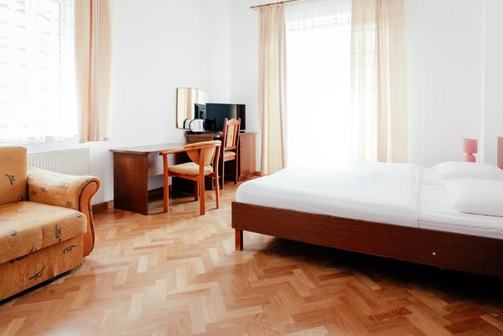 Postel nebo postele na pokoji v ubytování Gościniec Jędruś