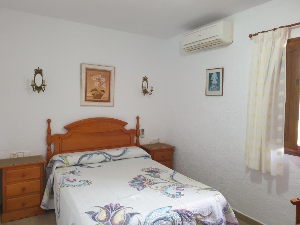 A bed or beds in a room at Casa Juanita