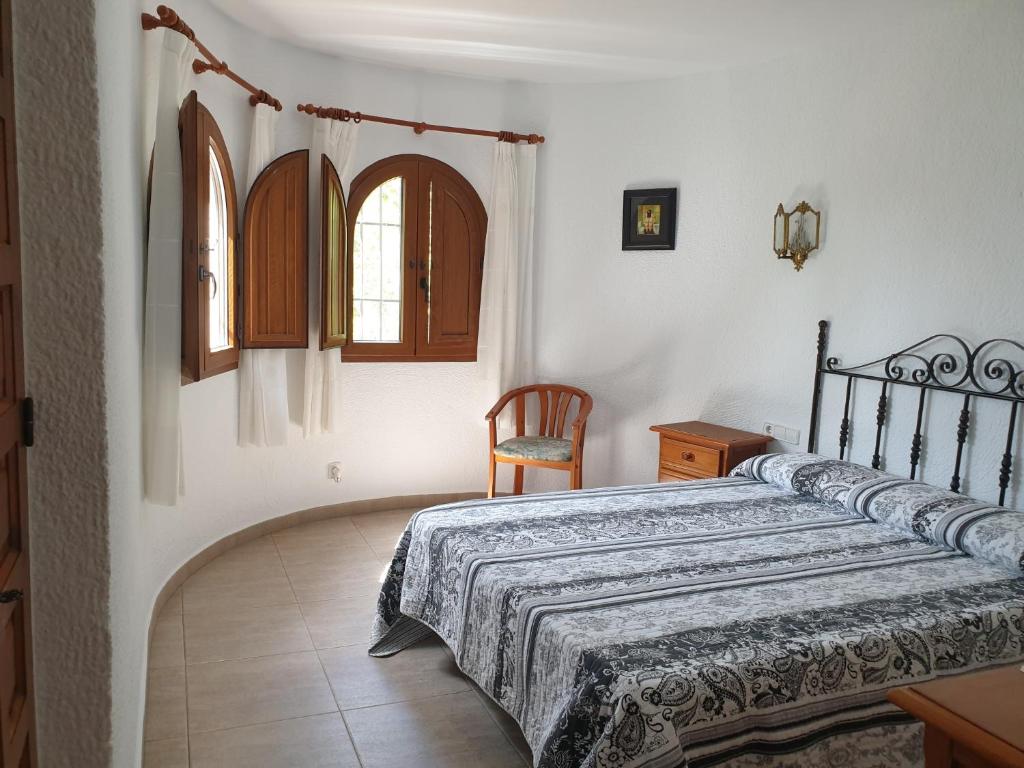 A bed or beds in a room at Casa Juanita