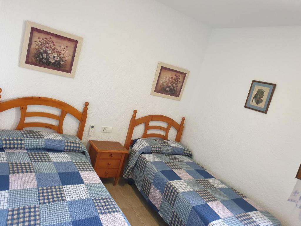A bed or beds in a room at Casa Juanita