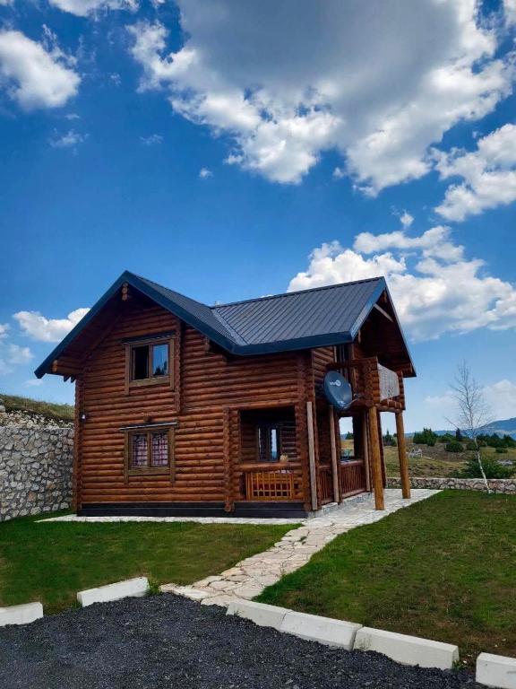 a log cabin with a black roof at LogCabin Žabljak in Žabljak