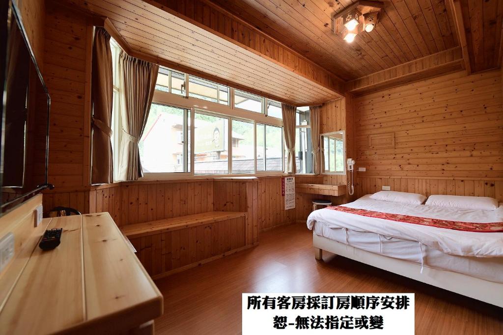 Voodi või voodid majutusasutuse 溪頭桂竹山莊民宿 toas