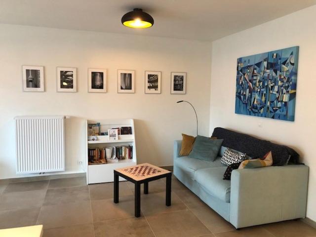 a living room with a couch and a table at Monico 0202 ref 49 in Koksijde