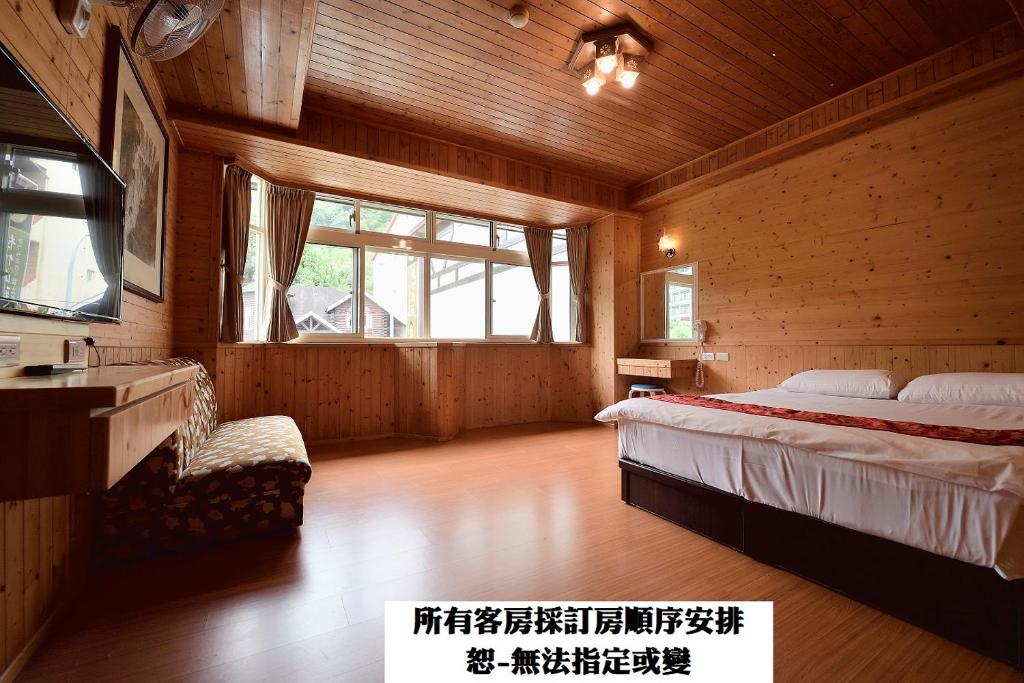 Voodi või voodid majutusasutuse 溪頭桂竹山莊民宿 toas