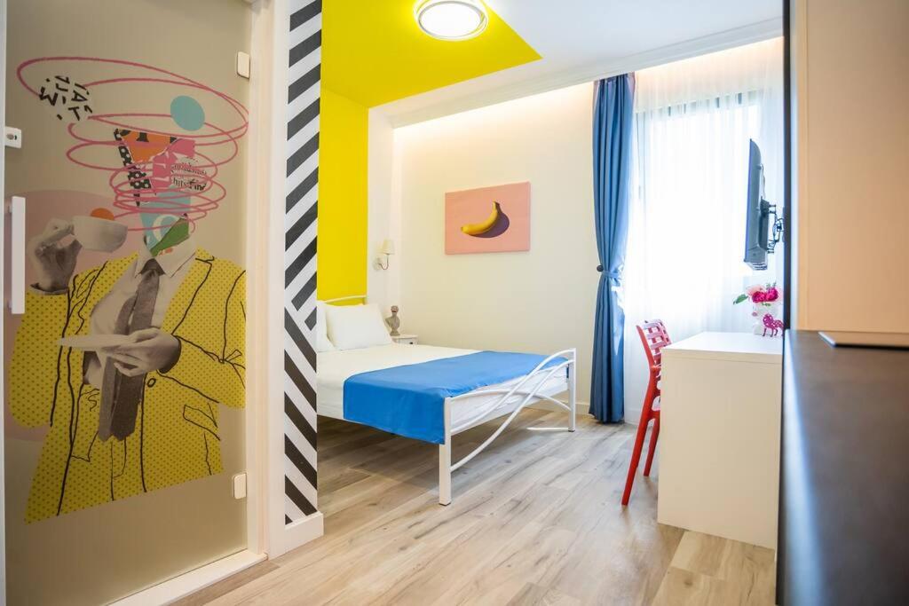 Postel nebo postele na pokoji v ubytování Studio Pop Art