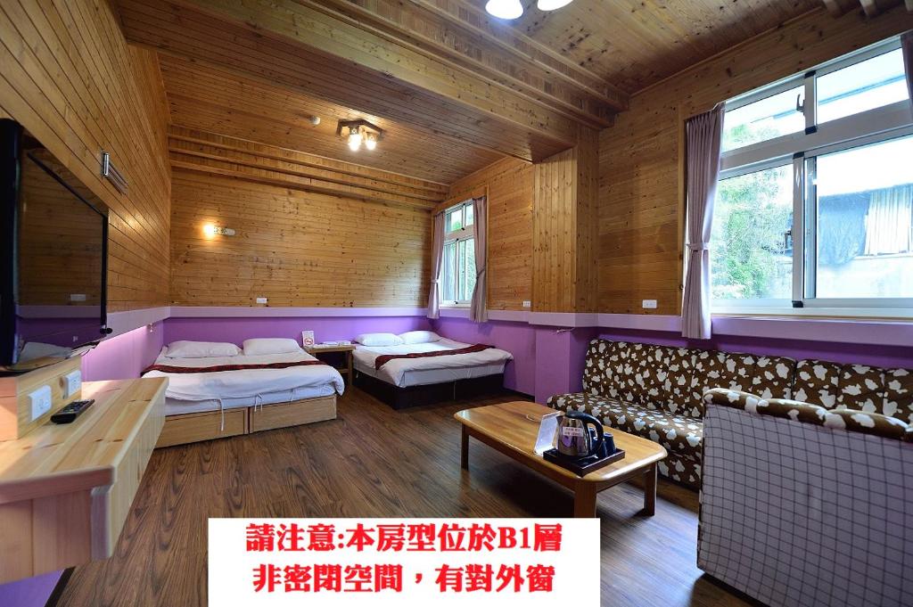 Voodi või voodid majutusasutuse 溪頭桂竹山莊民宿 toas