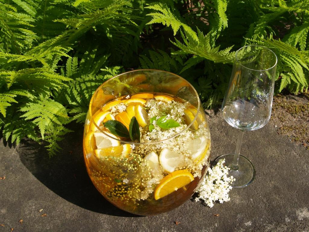a glass bowl of food next to a wine glass at Romantik Hotel Gasthaus Rottner in Nuremberg