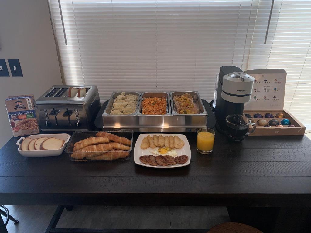 a table with many different types of food on it at Destination Family Hotel in Whitehorse