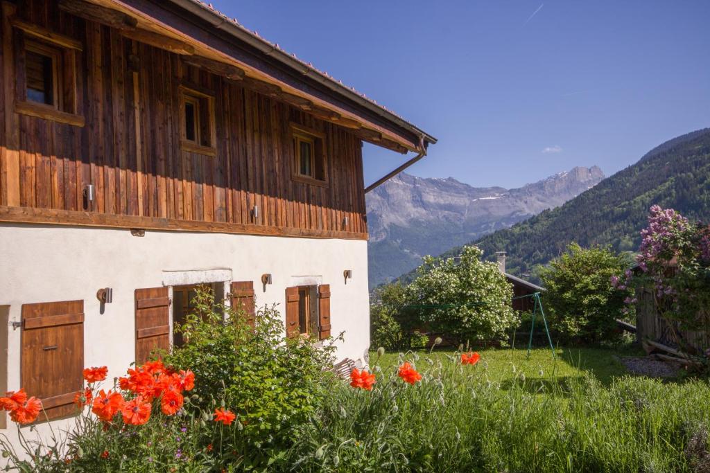 a house with flowers in front of it at Wanderful Life MontBlanc refuge haut de gamme in Saint-Gervais-les-Bains