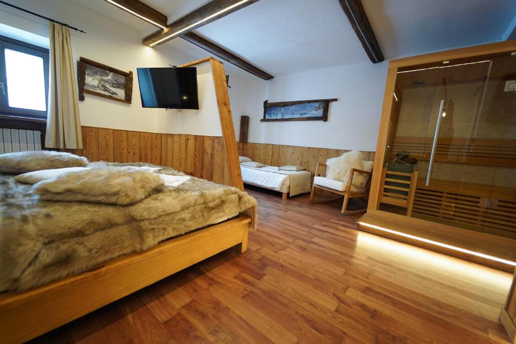 Postel nebo postele na pokoji v ubytování Hotel lo Stambecco