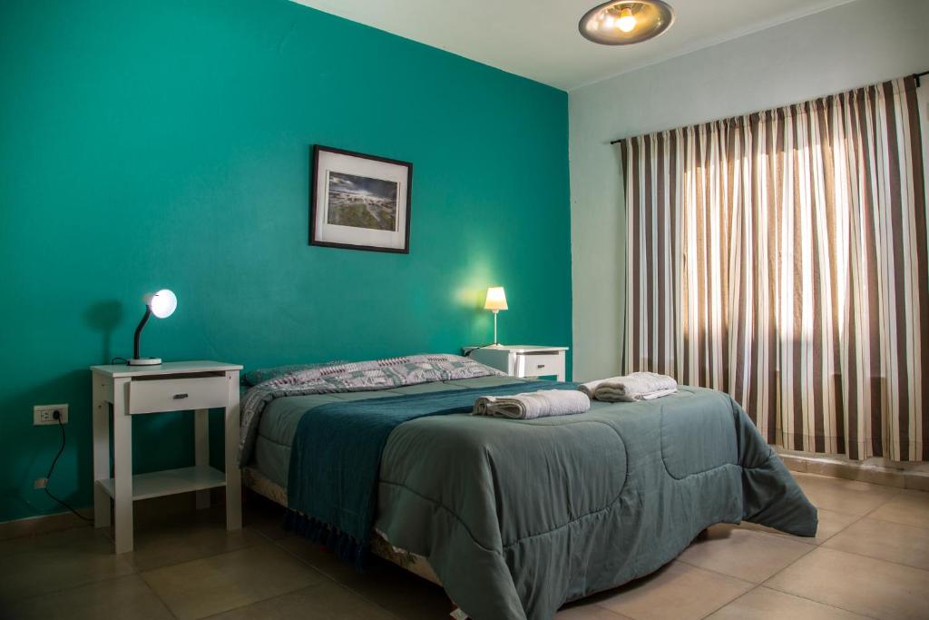 En eller flere senger på et rom på Los Palos Ribera Norte