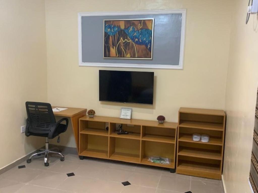 TV a/nebo společenská místnost v ubytování Rehoboth Homes