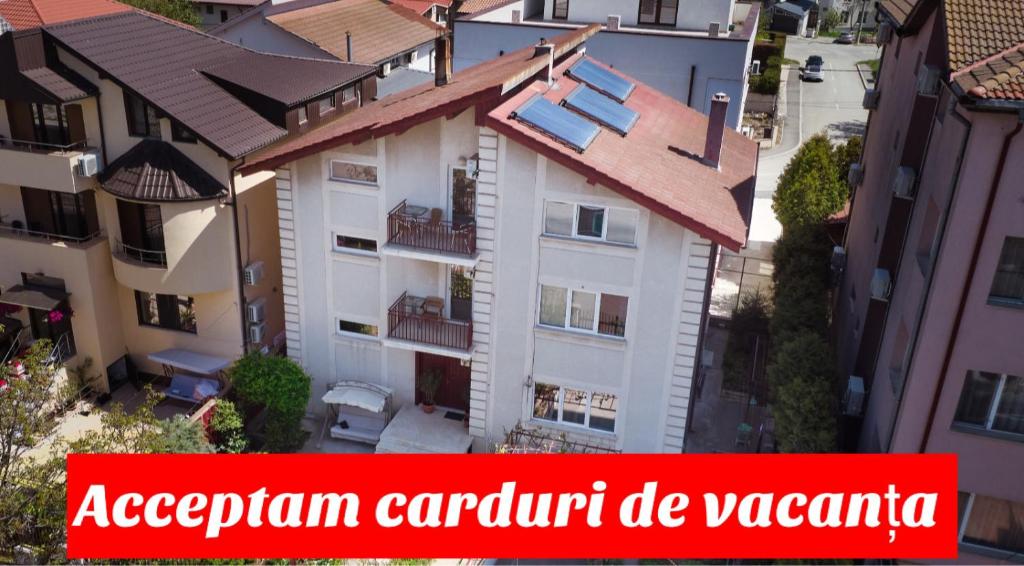 an image of a apartment building with the text acreprim control be vac at Vila Adriana in Eforie Nord