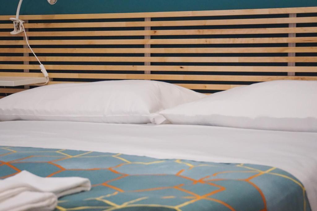 A bed or beds in a room at Roma Trasteverina