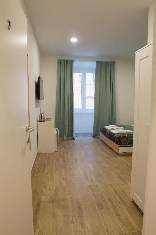 A bed or beds in a room at Roma Trasteverina
