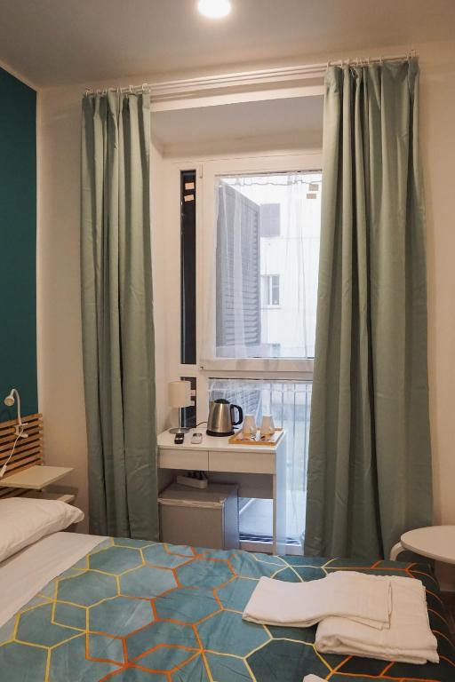 A bed or beds in a room at Roma Trasteverina