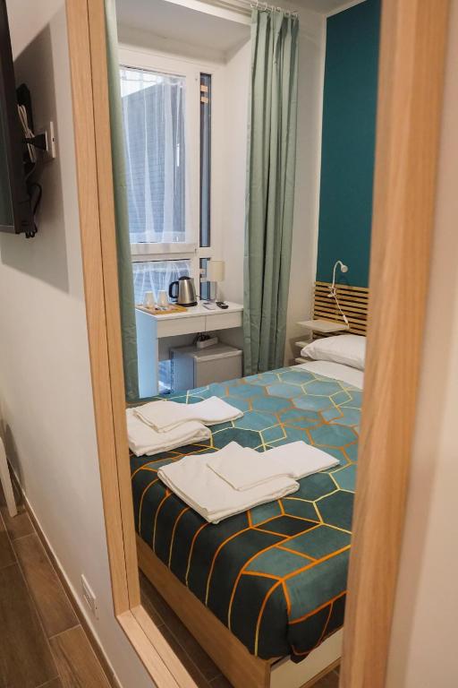 A bed or beds in a room at Roma Trasteverina