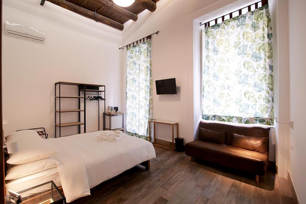 Postel nebo postele na pokoji v ubytování Antica Residenza Fusco