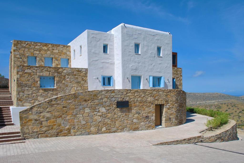 a building on top of a stone wall at Residence van Krienen in Ios Chora