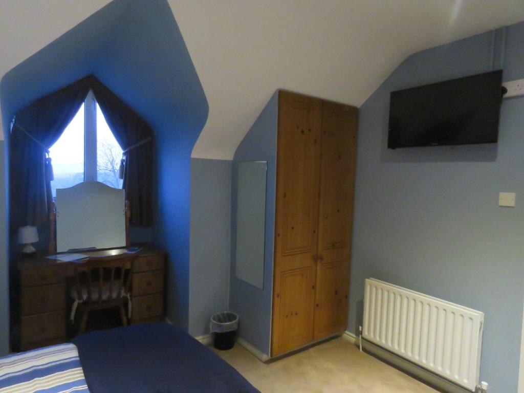 Postel nebo postele na pokoji v ubytování Greenside B&B
