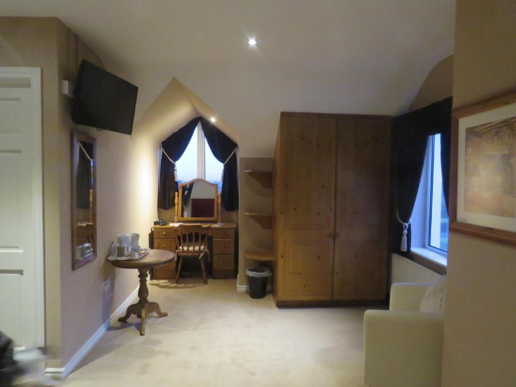 Postel nebo postele na pokoji v ubytování Greenside B&B