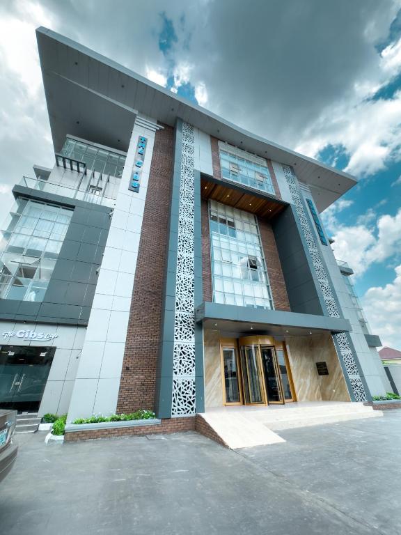 a large building with a lot of windows at The Gibs Hotel Limited in Port Harcourt
