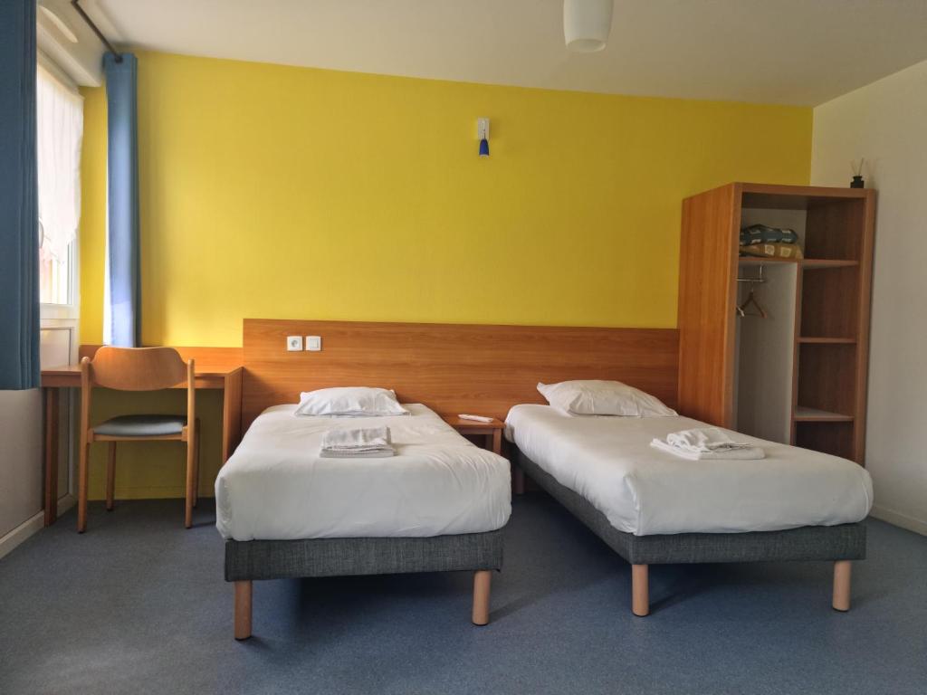 Postel nebo postele na pokoji v ubytování Hôtel VVF Eden Lake