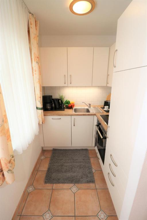 Kuchyň nebo kuchyňský kout v ubytování Wohnpark Strandstraße App 06