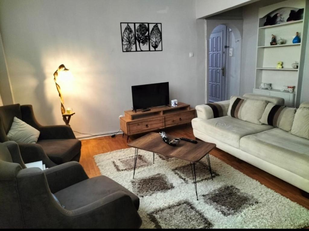 a living room with a couch and a coffee table at Şişli Özcan 1 in Istanbul