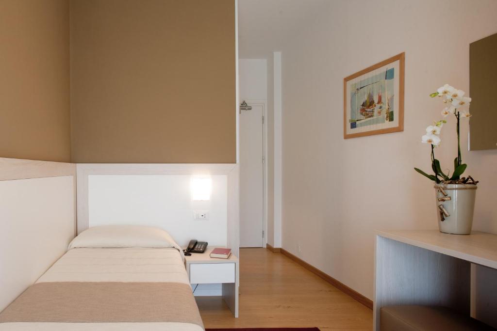 Postel nebo postele na pokoji v ubytování Hotel Canarie