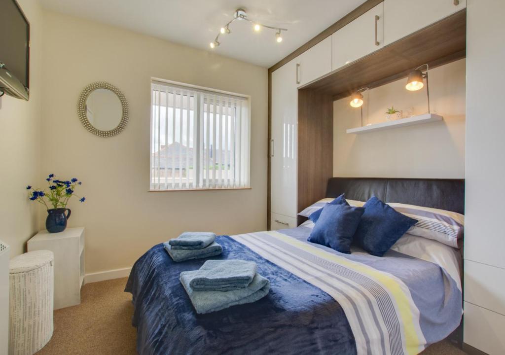 Giường trong phòng chung tại Sandringham