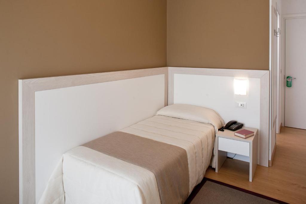Postel nebo postele na pokoji v ubytování Hotel Canarie