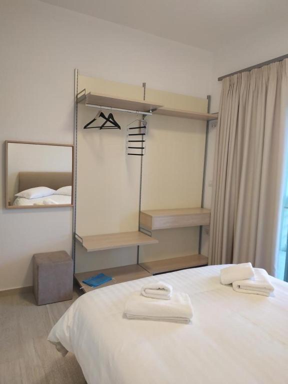 Postel nebo postele na pokoji v ubytování elea resort 2